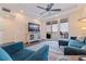 Well-lit living room with stylish decor and view of the outdoor balcony at 7922 Sailboat Key S Blvd # 105, South Pasadena, FL 33707