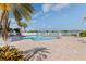 A brick pool deck surrounds the pool, offering lounging chairs and water views at 7922 Sailboat Key S Blvd # 105, South Pasadena, FL 33707