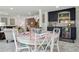 View of a quaint dining area with marble floors, stylish decor and a wet bar in the background at 805 Bannockburn Ave, Temple Terrace, FL 33617