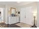 Bright foyer featuring a console table with decor, dark wood floors, and access to other rooms at 805 Bannockburn Ave, Temple Terrace, FL 33617