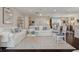 Spacious and bright living room featuring neutral tones, white sofas, and seamless flow to other living areas at 805 Bannockburn Ave, Temple Terrace, FL 33617
