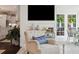 Bright interior with comfortable seating in the living room and view into the kitchen and dining area at 805 Bannockburn Ave, Temple Terrace, FL 33617