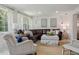 A spacious living room offers comfortable seating, natural light from the windows, and stylish decor at 805 Bannockburn Ave, Temple Terrace, FL 33617