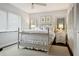 Bright main bedroom with a four poster bed, mirrors, and a ceiling fan at 805 Bannockburn Ave, Temple Terrace, FL 33617