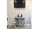Dining area with table and chairs with mounted television at 8565 W Gulf Blvd # 21S, St Petersburg, FL 33706