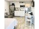 Cozy open living area with updated kitchen, stainless steel appliances, and ample natural light at 8565 W Gulf Blvd # 21S, St Petersburg, FL 33706