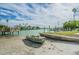 Picturesque waterfront property with a private dock and small boat at 8565 W Gulf Blvd # 21S, St Petersburg, FL 33706