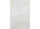 A walk-in closet boasts clean, bright space, featuring white walls and wire shelving for optimal storage at 907 E Okaloosa Ave, Tampa, FL 33604