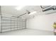 Spacious garage featuring ample lighting, a modern garage door, and a clean, finished interior at 907 E Okaloosa Ave, Tampa, FL 33604