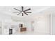 Modern kitchen boasts white cabinets, wine rack, stainless steel appliances, and an island with a wooden accent at 907 E Okaloosa Ave, Tampa, FL 33604