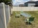 Fenced backyard featuring lawn and outdoor seating area perfect for entertaining at 9616 Lemon Drop Loop, Sun City Center, FL 33573