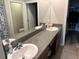 Bathroom with double sinks and granite countertops at 9616 Lemon Drop Loop, Sun City Center, FL 33573