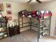 Bedroom with bed, desk, shelves and football decor at 9616 Lemon Drop Loop, Sun City Center, FL 33573