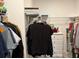 Walk-in closet with shelving, hanging racks, and dresser at 9616 Lemon Drop Loop, Sun City Center, FL 33573