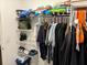 Walk-in closet with shelving and hanging racks at 9616 Lemon Drop Loop, Sun City Center, FL 33573