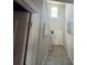 Well-lit entryway featuring tile flooring and stairway to the second floor at 9616 Lemon Drop Loop, Sun City Center, FL 33573