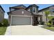 Charming two-story home with manicured garden and a two car garage at 9616 Lemon Drop Loop, Sun City Center, FL 33573