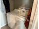 Bright laundry room with a front-load washer, dryer, and wire shelving at 9616 Lemon Drop Loop, Sun City Center, FL 33573