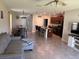 Comfortable living room blending seamlessly with the modern kitchen and dining area in an open layout at 9616 Lemon Drop Loop, Sun City Center, FL 33573