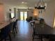 Open living area with views to a backyard, a comfortable sofa and stylish decor at 9616 Lemon Drop Loop, Sun City Center, FL 33573