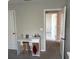 Study featuring desk, chair, and neutral decor at 9616 Lemon Drop Loop, Sun City Center, FL 33573