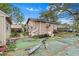 Exterior view showing an overgrown backyard needing some cleanup and landscape restoration at 10803 N Florence Ave, Tampa, FL 33612