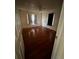 Empty bedroom featuring hardwood floors and natural light at 10803 N Florence Ave, Tampa, FL 33612