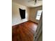 A bright bedroom with beautiful hardwood floors, light walls, and windows offering natural light at 10803 N Florence Ave, Tampa, FL 33612