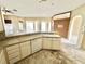 The kitchen features white cabinets, lots of counter space, and modern appliances at 1145 Riveredge Dr, Tarpon Springs, FL 34689