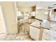 This kitchen boasts lots of cabinets and counter space for your cooking needs at 1145 Riveredge Dr, Tarpon Springs, FL 34689