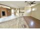Bright living room with hardwood floors and open floor plan to the kitchen at 1145 Riveredge Dr, Tarpon Springs, FL 34689