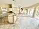 Spacious living area showcasing a seamless flow from kitchen to the backyard oasis at 1145 Riveredge Dr, Tarpon Springs, FL 34689