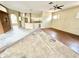 Open concept living room and kitchen area with ceiling fan at 1145 Riveredge Dr, Tarpon Springs, FL 34689