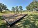 Community swingset over wood chips at 1145 Riveredge Dr, Tarpon Springs, FL 34689