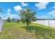 Expansive backyard with a well-maintained lawn and a privacy fence at 11606 Kilkenny Coral Dr, Riverview, FL 33579
