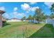 Beautiful, well-kept backyard featuring lush green grass and a white vinyl fence at 11606 Kilkenny Coral Dr, Riverview, FL 33579