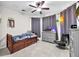 Bedroom with a trundle bed, tile floors, and modern ceiling fan and light fixture at 11606 Kilkenny Coral Dr, Riverview, FL 33579