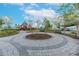 Community park with playground, seating area, landscaping, and walking paths at 11606 Kilkenny Coral Dr, Riverview, FL 33579