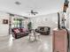 Cozy living room featuring neutral walls, tile flooring, and modern decor at 11606 Kilkenny Coral Dr, Riverview, FL 33579