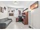 Office space with light walls, tile floors, natural light, and decor at 11606 Kilkenny Coral Dr, Riverview, FL 33579