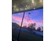 Covered patio view of a beautiful sunset with an orange and purple sky at 11606 Kilkenny Coral Dr, Riverview, FL 33579