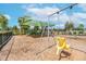 Community playground featuring swings, play structure, and a protective shade covering for hours of fun at 11606 Kilkenny Coral Dr, Riverview, FL 33579