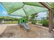 Playground structure featuring a slide and benches within a fenced community area at 11606 Kilkenny Coral Dr, Riverview, FL 33579