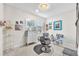 Flex space with white walls, tile floors, light, and decor at 11606 Kilkenny Coral Dr, Riverview, FL 33579