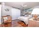 Bedroom with light walls, wood floors, and ceiling fan at 12303 Fieldstone Ln, Hudson, FL 34667