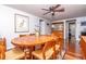Dining room featuring wood table and chair set and natural light at 12303 Fieldstone Ln, Hudson, FL 34667