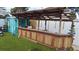 Outdoor bar perfect for entertaining, next to a shed at 12425 Ridge Rd, Largo, FL 33778