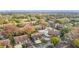 Aerial view of the community with mature trees and a swimming pool at 12804 Wedgewood Way # C, Hudson, FL 34667