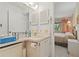 Well-lit bathroom with ample counter space and convenient built-in storage at 12804 Wedgewood Way # C, Hudson, FL 34667