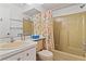 This bathroom features a toilet, sink, and tub with a shower at 12804 Wedgewood Way # C, Hudson, FL 34667